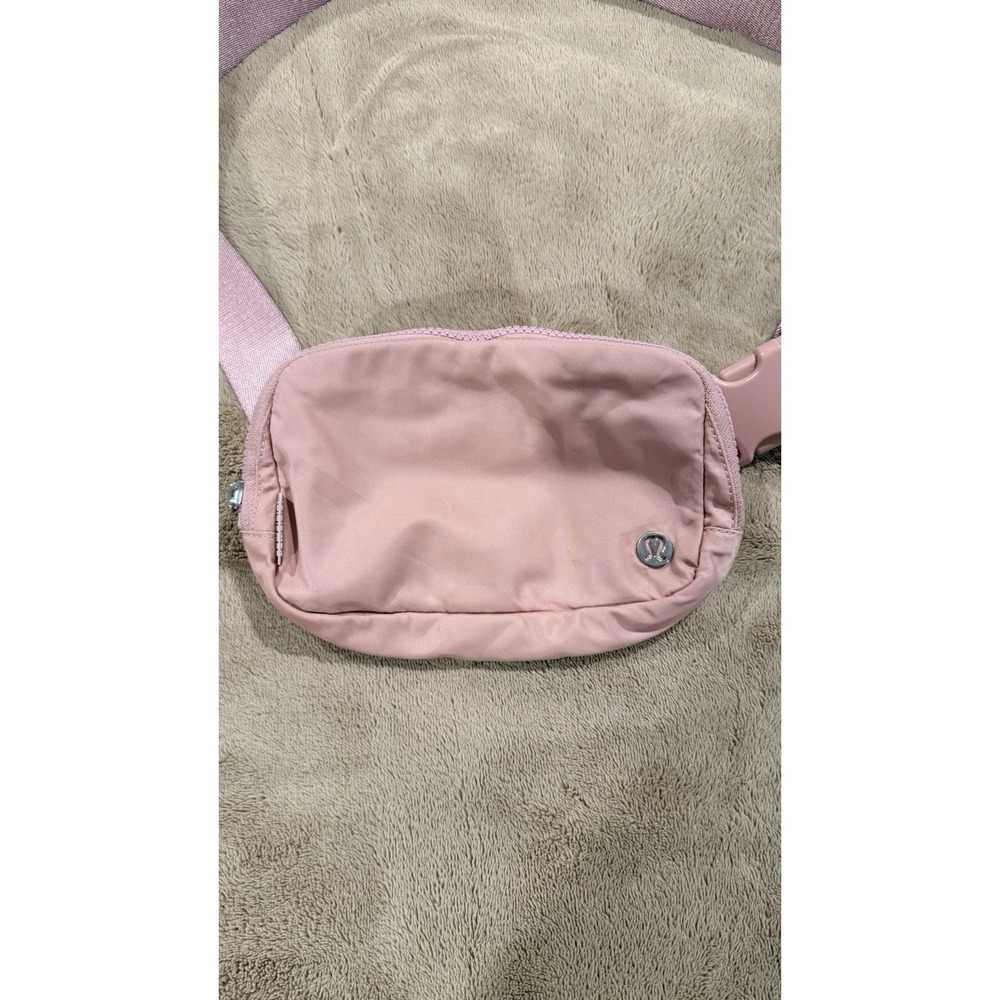 Lululemon Athletica Everywhere Belt Bag 1L in a light pink color